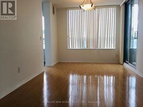 Toronto (Willowdale East) condo for rent - A room with wooden floors and a window with blinds.