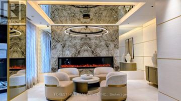 Toronto (Newtonbrook West) condo for rent - A living room with a fireplace and a large marble wall.