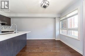 Clarington (Bowmanville) townhouse for rent - A kitchen with a sink and a window.