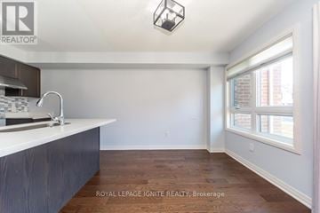 Clarington (Bowmanville) townhouse for rent - A kitchen with a sink and a window.