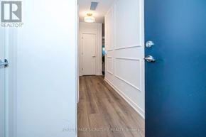 Toronto (Rouge) condo for rent - A hallway with white doors and a blue wall.