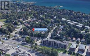 Toronto (Birchcliffe-Cliffside) condo for rent - An aerial view of a coastal town with a Merge Condo signposted.