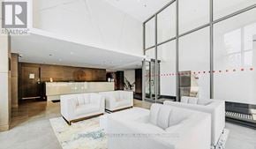 Toronto (Birchcliffe-Cliffside) condo for rent - A realtor's office with white furniture and glass walls.