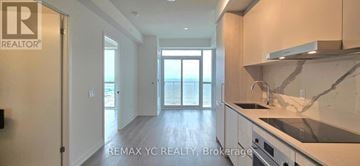 Vaughan (Vaughan Corporate Centre) condo for rent - A kitchen with a marble countertop and stainless steel appliances.