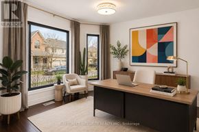 Oakville (Wm Westmount) apartment for rent - A well-lit room with a desk, chair, and a large window showing an outdoor view.