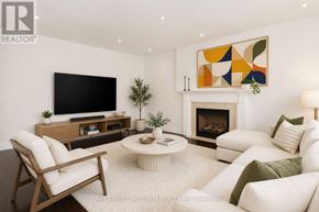 Oakville (Wm Westmount) apartment for rent - A living room with a fireplace and a television.