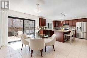 Oakville (Wm Westmount) apartment for rent - A modern kitchen with a dining table and chairs.