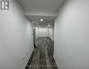 Brampton (Bram East) apartment for rent - A long hallway with a door at the end.