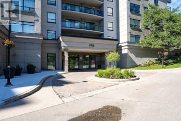 Cambridge condo for rent - The front of apartment building number 170 with a landscaped area in front.