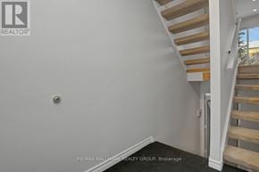 Ottawa townhouse for rent - A staircase with wooden steps and white railings.
