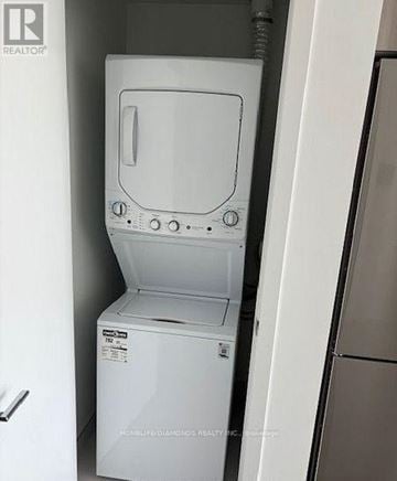 Oakville (Jm Joshua Meadows) condo for rent - A white dishwasher is in a kitchen.