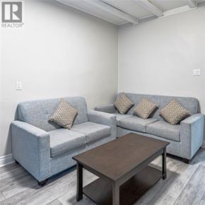 Hamilton apartment for rent - A living room with a grey couch and a coffee table.
