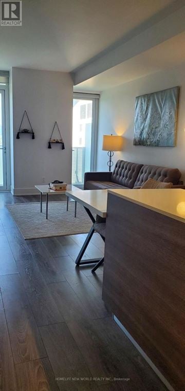 Toronto (Annex) condo for rent - A living room with a brown couch and a painting on the wall.