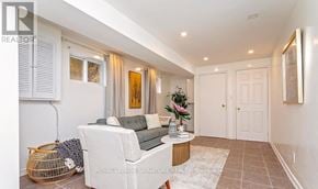 Mississauga (Erin Mills) apartment for rent - A living room with a white sofa and a wooden coffee table.