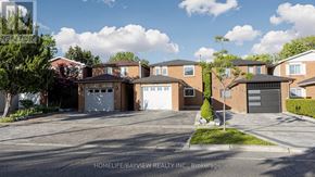 Richmond Hill (North Richvale) apartment for rent - A row of houses with garages are for sale by Homelife/Bayview Realty Inc.