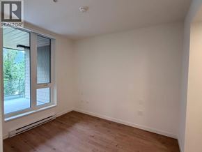Squamish apartment for rent - A room with a window and wooden flooring.
