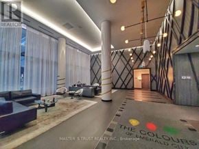 Toronto (Henry Farm) condo for rent - A hallway with a rug on the floor and a sign that says "The Colours of Brokerage Meralco City".