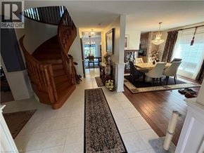 Ancaster apartment for rent - A living room with a staircase and a dining area.