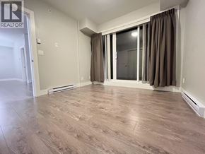 Burnaby apartment for rent - A room with wooden flooring and a sliding glass door.