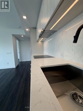 Toronto (North St. James Town) condo for rent - A modern kitchen with a sink and a countertop.