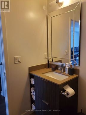 Toronto (Henry Farm) condo for rent - A bathroom with a sink, mirror, and toilet paper roll.