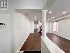 Ajax (Northeast Ajax) apartment for rent - A hallway with a wooden floor and white walls.