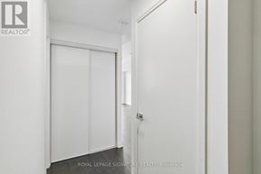 Mississauga (City Centre) condo for rent - A white door with a glass window is closed.