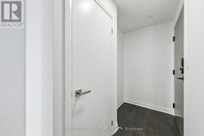 Mississauga (City Centre) condo for rent - A white door with a handle and a Royal LePage logo on the left side.