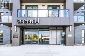 Hamilton (Waterdown) condo for rent - The entrance to a building with the word "trend" on it.