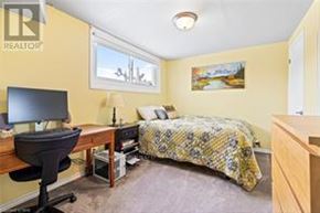 St. Catharines (Secord Woods) apartment for rent - A bedroom with a bed, desk, and chair.