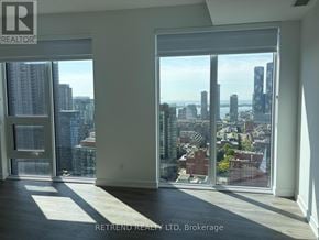 Toronto (Church-Yonge Corridor) condo for rent - A room with a view of the city through large windows.