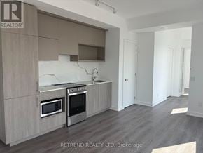 Toronto (Church-Yonge Corridor) condo for rent - A kitchen with a refrigerator, microwave, and oven.