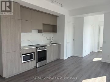 Toronto (Church-Yonge Corridor) condo for rent - A kitchen with a refrigerator, microwave, and oven.