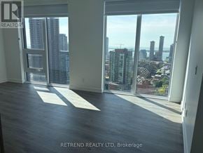 Toronto (Church-Yonge Corridor) condo for rent - A room with a view of the city skyline through large windows.