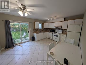 London South (South X) apartment for rent - A kitchen with white cabinets and a white table.