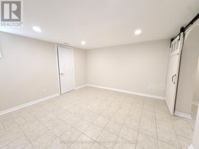 Toronto (Newtonbrook East) apartment for rent - A spacious room with a door and a wall-mounted closet.