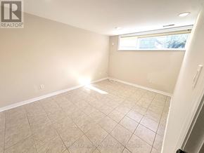 Toronto (Newtonbrook East) apartment for rent - A room with beige tiled flooring and a window letting in sunlight.