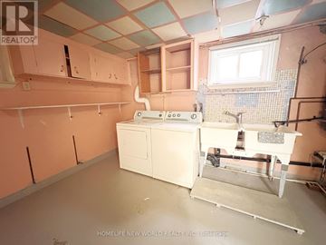 Toronto (Newtonbrook East) apartment for rent - A kitchen with a stove and sink in a room under construction.