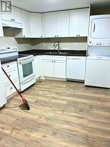 London South (South X) duplex for rent - A kitchen with white appliances and cabinets.
