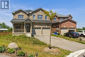 Kawartha Lakes (Lindsay) apartment for rent - A large house with a carport and a garage is for sale.