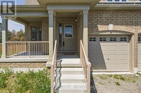 Kawartha Lakes (Lindsay) apartment for rent - A house with a brown brick exterior and a white door and windows.