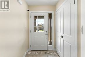 Kawartha Lakes (Lindsay) apartment for rent - A white door with a glass window is in a room with white walls.