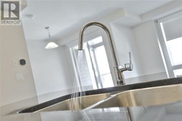 Hamilton (Fruitland) townhouse for rent - A modern kitchen sink with a faucet and running water.