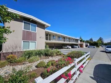 Mountain View apartment for rent - Apartment building number 470 with a white picket fence and flowers in front.