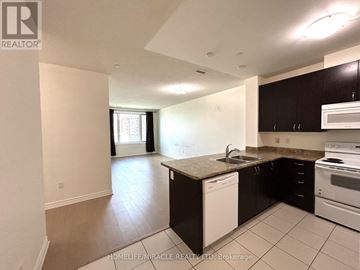 Markham (Middlefield) condo for rent - A kitchen with a white dishwasher and stove top oven.