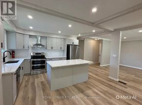 St. Catharines (Burleigh Hill) apartment for rent - A modern kitchen with a large island in the middle.