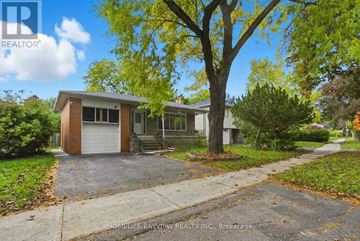 Toronto (Bayview Woods-Steeles) apartment for rent - A house with a tree in front of it.