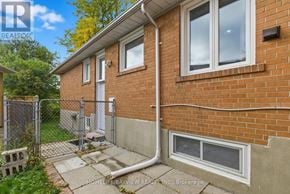 Toronto (Bayview Woods-Steeles) apartment for rent - A brick house with a white door and a small porch.