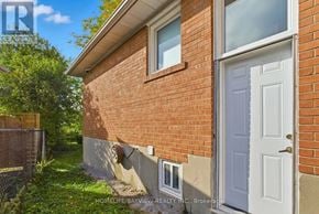 Toronto (Bayview Woods-Steeles) apartment for rent - A brick house with a white door and a window.
