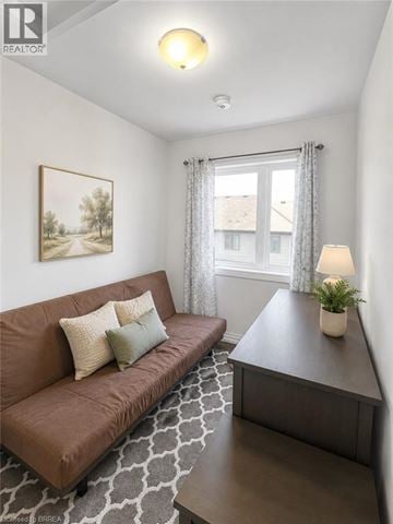 Paris townhouse for rent - A living room with a brown couch and a grey coffee table.